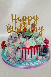 trolls birthday drip cake